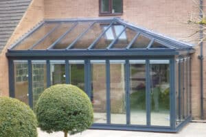 Hipped glass roof with bifold doors below