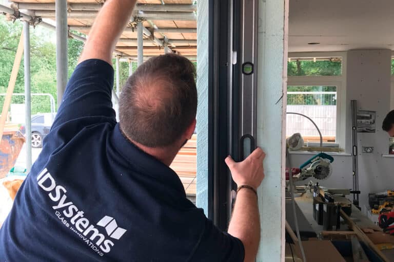 Installing sliding doors at the Build it Selfbuild Education House at Graven Hill in Bicester