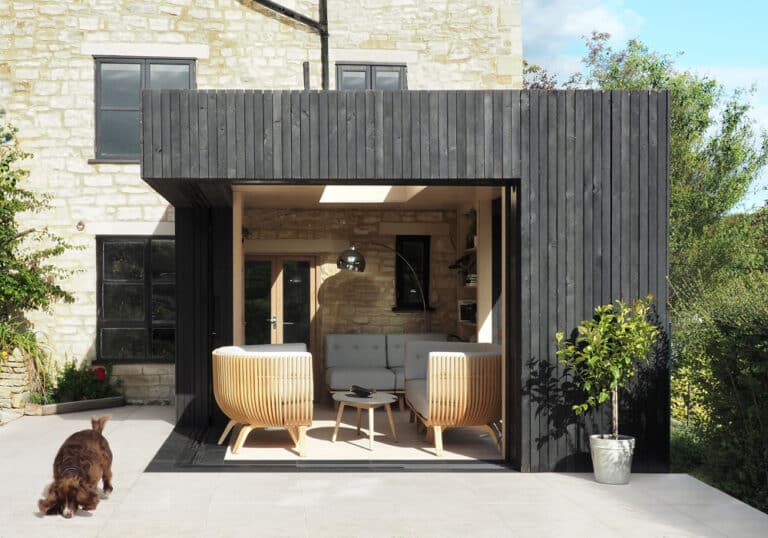 The Reading Room in Gloucestershire featuring open corner sliding doors which slide into a pocket