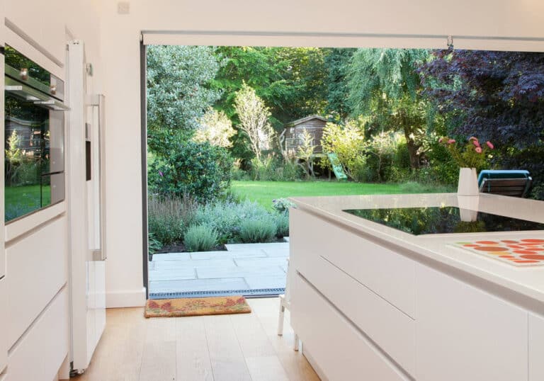 Open pocket sliding doors provide seamless transition between inside and out