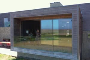 IDSystems theEDGE2.0 sliding doors - large 3-panel set of sliding doors open up the house onto a balcony