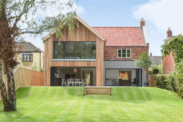 Three sets of SF55 bifold doors on this rural self-build home