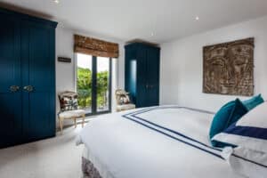 The master bedroom features SF55 French doors that open out onto a balcony