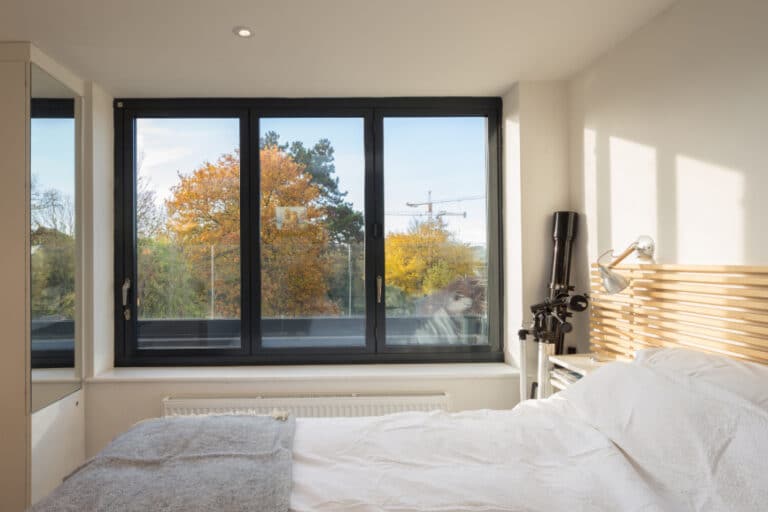 A stylish bifold window design completely opens up the view of the Cambridge skyline