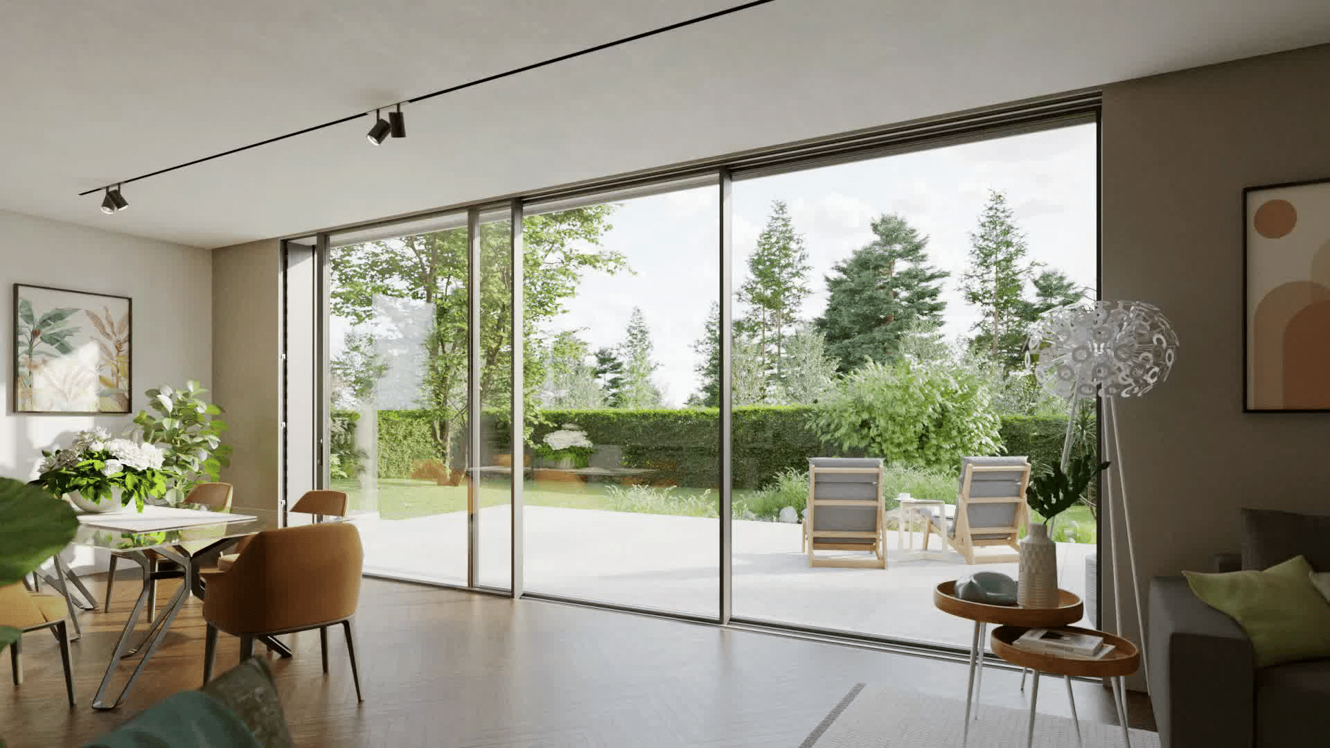 Modern living space with expansive sliding doors opening onto a sunlit garden, featuring slim-profile aluminium frames and unobstructed views.