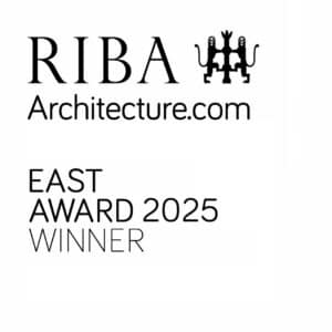 RIBA Architecture.com logo with the text "East Award 2025 Winner" displayed below.