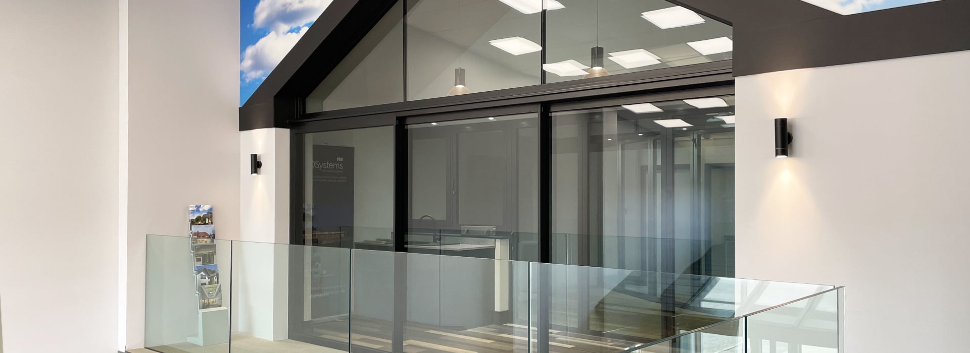 IDSystems showroom in Norwich displaying modern sliding doors and glazing systems with glass balustrade entrance.