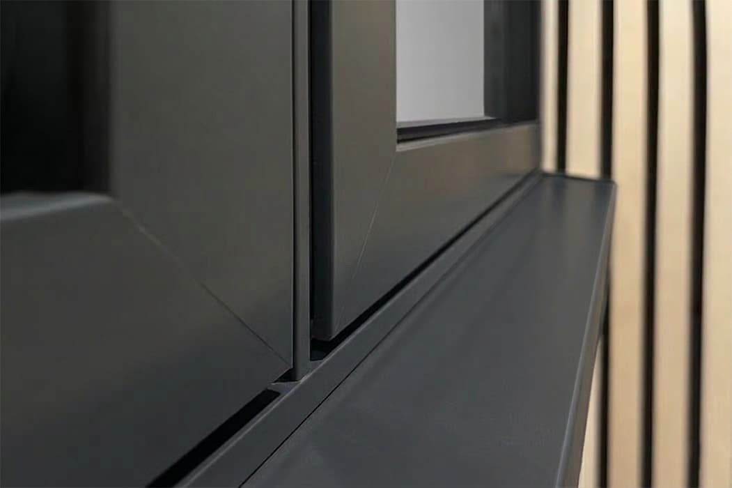 Sleek aluminium casement window frame with slim profile design, showcasing clean lines and minimalist aesthetic in contemporary setting.